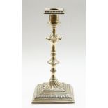 A mid 18th Century Paktong silver candlestick,