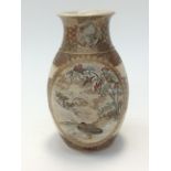 A Satsuma vase finely decorated with immortal figures and bird decorated panels