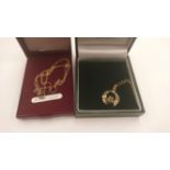 Two 9ct gold pendants comprising a Claddagh and a three ring pendant,