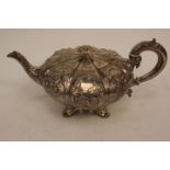 A Victorian silver teapot with repousse floral decoration 22.07 troy oz, 686.