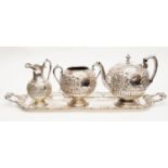 A Victorian style large silver plate tea service including tea pot, sugar bowl, milk jug,