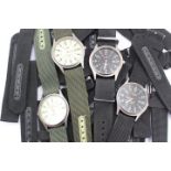 Twenty nine (29) Soki Gentleman's wristwatches and a good quantity of textile watch straps,