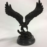 A Bronze Eagle with outspread wings. 40cm in height.