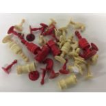 32 piece loose ivory and dyed red ivory chess pieces, from 4 cms to 8.