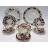 A selection of porcelain including a set of three Coalport 938 tea cups and saucers with one side