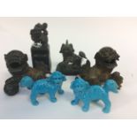 A pair of Chinese bronze dogs of fo, a hardstone seal with dog of fo finial,