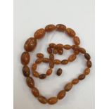 Amber bead necklace, oval graduated beads, some loose beads, with a total gross weight approx 55.