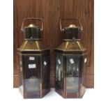 A pair of brass carriage hand held oil lamps,