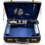 A 'Finnegans', of Bond Street, London, navy blue leather case with protective cloth cover,