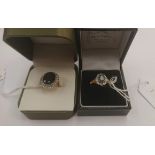 Two 9ct gold rings set with stones, comprising a dark sapphire and diamond cluster ring,