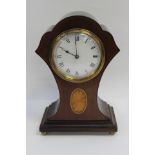 An early 20th Century mahogany balloon shaped mantle clock,