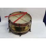 A Military side drum with sticks. 37 cm in diameter. Brass body Maker marked "Henry Potter & Co.