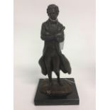 A Bronze figure of rthe composer Ludwig Von Beethoven. On a marble base. 21cm in height.