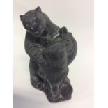 Modern "The Wolf" sculptures cast pottery dark grey figure of an Eskimo and bear figure (1)