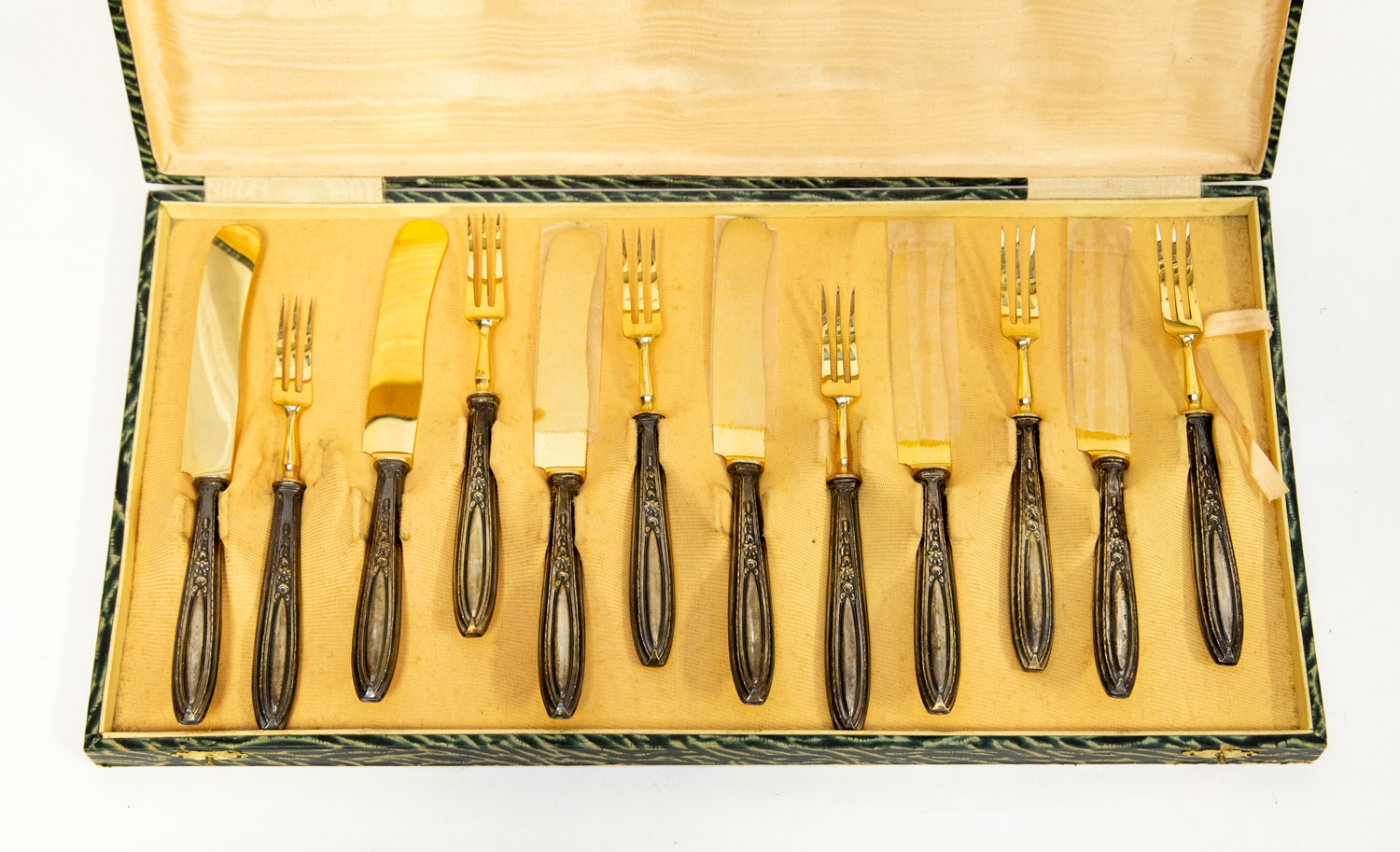 Twelve piece Italian gilt gold on silver knives and forks