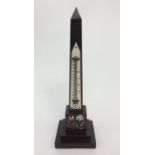 An Ashford marble obelisk thermometer with inlaid flower