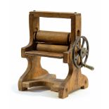 An early 20th Century child's oak toy wooden mangle, circa 1920's,
