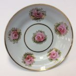 A Charles Bourne deep plate, painted with pink roses within gilt sprigs, pattern No.