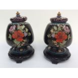 Two Cloisonne footed ginger jars and covers,