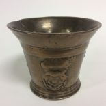 A bronze mortar late 16th Century or earlier possible, depicting Roses,