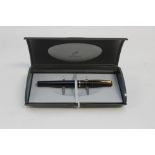 A Parker black cased fountain pen, with gilt metal nib,