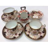 Two Royal Crown Derby 3788 pattern coffee cans and saucers, one matching tea cup and saucer,