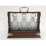 Victorian three cut glass decanter oak tantalus with plated detailing (no key present)