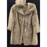 A cream mink 3/4 coat with shawl collar double breasted and a matching beret hat (2)