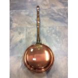 An Edwardian copper bed pan,