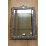 A large Edwardian silver mounted dressing table mirror,