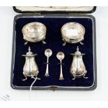 a cased silver salt sellers and pepper pot with spoons Sheffield 1917 all hallmarked gross silver