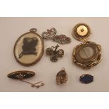 A Victorian navette shape onyx memorial brooch, set with seed-pearls, rope twist border,