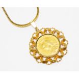 A Victorian Sovereign, dated 1891, in pierced 9ct gold pendant mount,