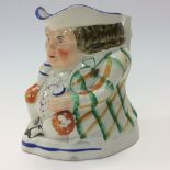 An early 19th Century hand painted Toby jug,