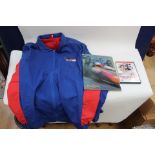 A group of items to include a F1 Borg and Beck jacket, a Grand Prix film DVD,