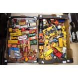 Two trays of Matchbox diecast vehicles and Britains tractors