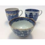 Two blue and white coffee cups,