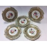 Four painted cabinet plates with a matching dish circa 1840,