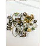 A silver star brooch, white metal diamante brooch, cut glass bead necklace, gilt metal brooch,