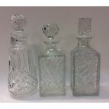 Three moulded glass spirit decanters