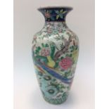 An 18th Century Chinese vase, baluster form, with exotic birds, peony, trees, Prunus blossom,