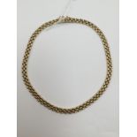 A 9ct yellow gold collar necklace, interlinked brick style links width approx 8mm, approx length 16.