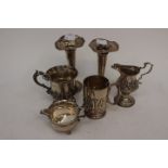 An inscribed 1913 tankard with arts and crafts leaf and flower together with another inscribed and