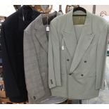 A navy Yves Saint Laurent (pour homme) for men, a grey Prince of Wales check suit,