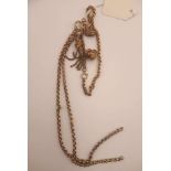 A Victorian yellow metal belcher necklace and bracelet with charms and tassel,