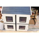 A large dolls house 77 cms x 76 cms