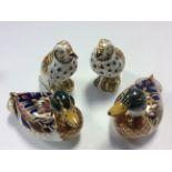 Royal Crown Derby song thrush paperweights, together with two mallard paperweights,