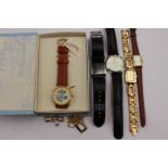 A group of five assorted watches to include a boxed Timex Winnie The Pooh watch