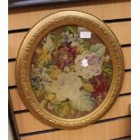 A framed and glazed oval wool work floral pattern,