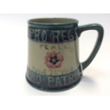 WW1 Peace Mug by Moorcroft, Burslem. Signed to underside "From Lady Liberty". 95mm in height.